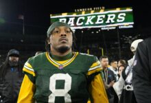 Green Bay Packers running back Josh Jacobs on the field during a game at Lambeau Field.